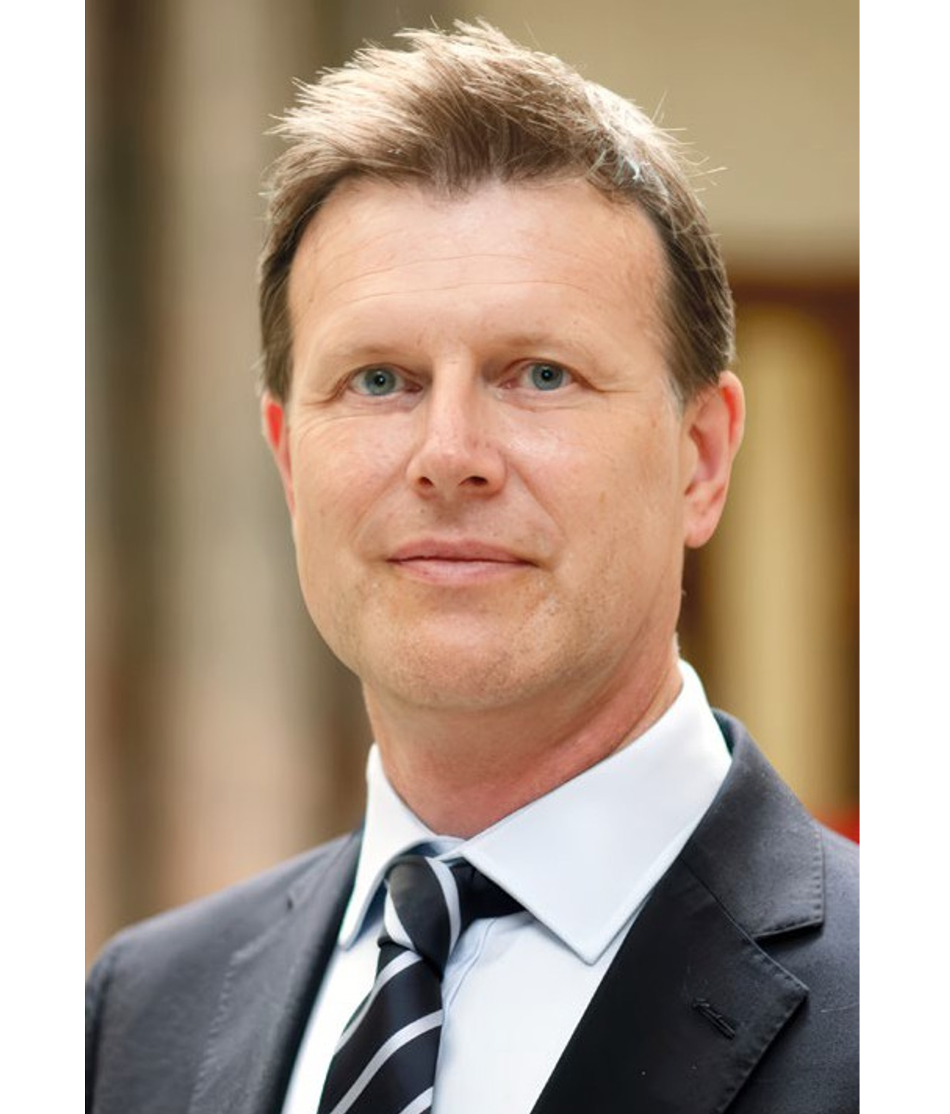 H E  Giles Portman